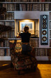 © ADDICTIVE STOCK - Vinyl lover enjoying music in cozy room