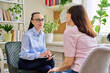 Professional mental psychologist at therapy session with female patient