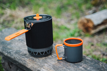 Sticker - Camping utensils, a pot with a mug, a cooking system, a set of camping utensils.