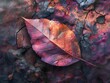 Leaf on cracked surface with red and purple background