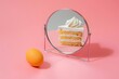 Raw egg in front of the mirror with reflection of piece of cake. AI generative art