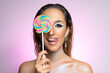 Beauty fashion model girl wiht colourful lollipop. Beautiful young woman portrait.