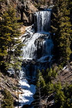 A View Of Undine Falls In Yellowstone National Park On A Sunny Day.