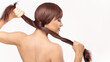 Beautiful brunette model demonstrating healthy long hair, perfect for beauty and hair care concepts