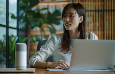 Wall Mural - Asian woman, office and laptop in office at work desk, workplace and employee for email. Virtual assistant device, online or help from internet for female worker, web designer or creative for meeting