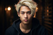 A young Asian man with blond hair