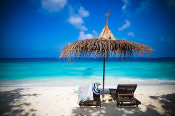 Wall Mural - beach chairs on beautiful tropical beach