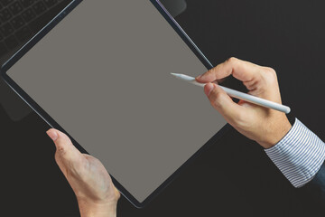 Businessman, a graphic designer using a stylus pen on the digital tablet screen, Man in casual ware online working