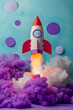 © Starmarpro - Night launch of a cardboard rocket. Children play time story time. Purple background with copy space. High quality photo