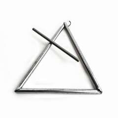 Metal triangle instrument with striking rod on white background