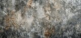 Fototapeta  - High-resolution image of a vintage grunge concrete wall texture featuring natural patterns, weathering effects, and a mix of gray and brown tones suitable for background or design elements