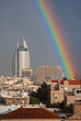 A close up view of Haifa downtown after a rainy day with rainbow in the background 
