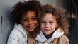portrait of an african american kid and caucasian child hugging and looking at camera, diverse children smiling, black and white kids smiling