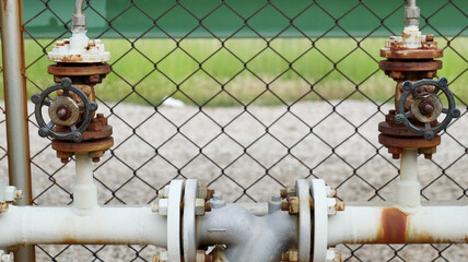 Wall Mural - Two valves on a rusty pipe