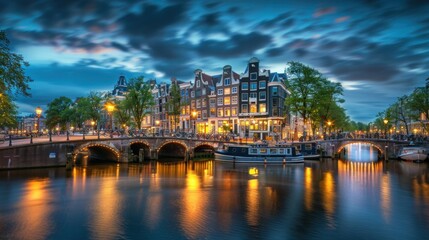 A beautiful night in Amsterdam. At night, the illumination of buildings and boats along the canals. Travel. Accommodation. Hotels.