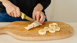 woman cutting banana slices. sliced banana. banana slices . Generative Ai