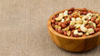 wooden bowl with mixed nuts. Healthy food and snack. Generative Ai