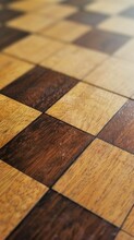The Intricate Details Of A Chess Board's Wooden Surface