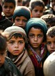 Refugee children with sad faces looking at the camera