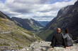 Couple Enjoying Majestic Mountain Valley View of Trollstigen