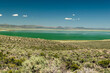 Expansive view of a vibrant turquoise lake in Mono County.