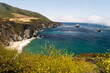 Coastal cliffs and turquoise waters along Big Sur under a misty sky!