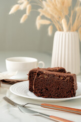 Wall Mural - Fresh homemade chocolate sponge cake on wooden board