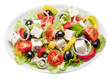 Greek salad on white plate isolated on white background. File contains clipping path.