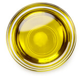 Fototapeta  - Glass bowl of olive oil on white background, top view.. File contains clipping path.