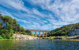 Fototapeta  - The Pont du Gard is an ancient Roman aqueduct, that is depicted  on five euro note. Summer 2022.