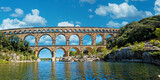 Fototapeta  - The Pont du Gard is an ancient Roman aqueduct, that is depicted  on five euro note. Summer 2022.