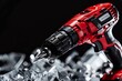 Red and black cordless drill with metal drill bit on black background