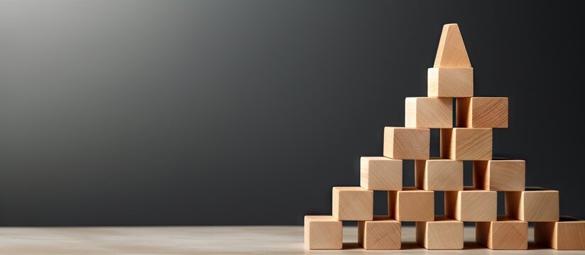 A pyramid shaped stack of premium wooden blocks from Korea with copy space available for educational use