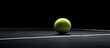 A tennis ball is lying on a black surface creating a simple and visually appealing image with space for text or other elements. Copy space image. Place for adding text and design