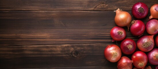 Wall Mural - A top view of a cutting board with vibrant onions placed on a rustic wooden surface creating an appealing composition with empty space for additional images or text