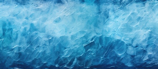 Sticker - A winter themed image with a texture resembling frozen water The ice surface creates an abstract blue background perfect for a copy space image