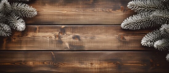 Poster - A snowy fir tree on a wooden Christmas background seen from above with ample empty space for your text