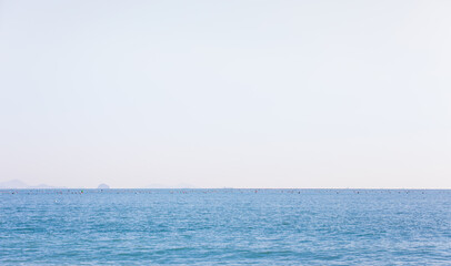 Sea landscape on a sunny day. water fog beyond the horizon