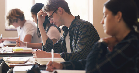 Aufkleber - High school, students and writing exam at desk in classroom for learning education, academic or scholarship. Boy, girl and academy campus for future development with lesson, assessment or studying