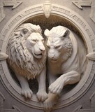 Fototapeta Motyle - Female and male lions ivory sculptures.