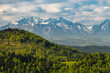 Green hills of Pieniny National Park and snowy Tatra Mountains in background in Poland