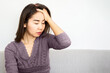 stress asian woman suffering from headache one side ,on the left side