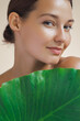 Natural Cosmetics Skin Care Beauty Product. Woman With Green Leaf