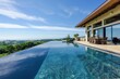 Elegant house with an infinity pool and a stunning view of rolling hills under a clear blue sky