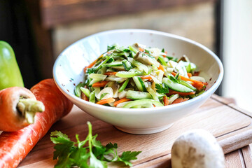 Wall Mural - White Bowl Filled With Vegetables Next to Green Pepper