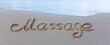 Word massage handwritten on the caribbean sand.