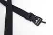 Black mens nylon fastening belt isolated on white background. Men's outdoor military tactical belt.