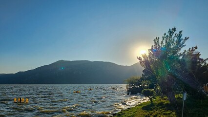 Poster - Scenic view of Dianchi Lake, Yunnan Province, China, with a bright sun in the sky