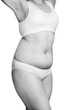 © Galaxy_love_design - Overweight female body in white lingerie.