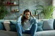 © Jorge Ferreiro - distraught woman sitting on sofa at home